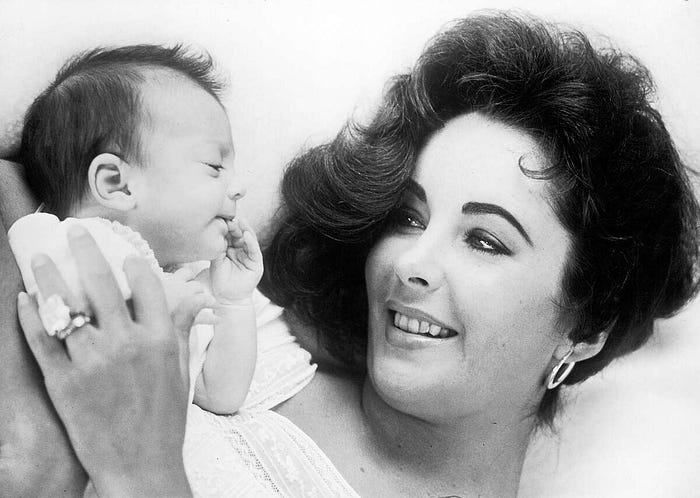 Elizabeth Taylor with daughter Liza Todd Burton, 1957 Credit: Toni Frissell