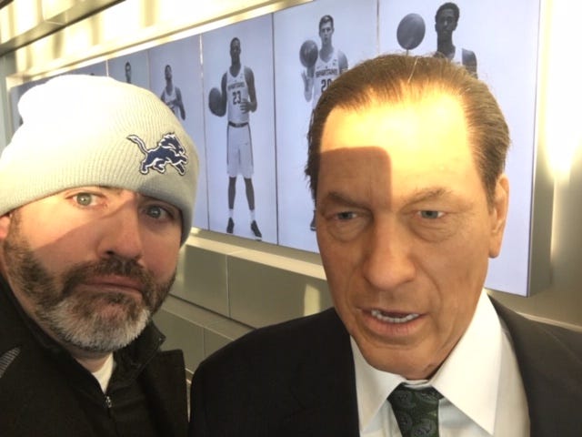 Matt Charboneau with Tom Izzo. One of these is a wax figure. You figure out who.