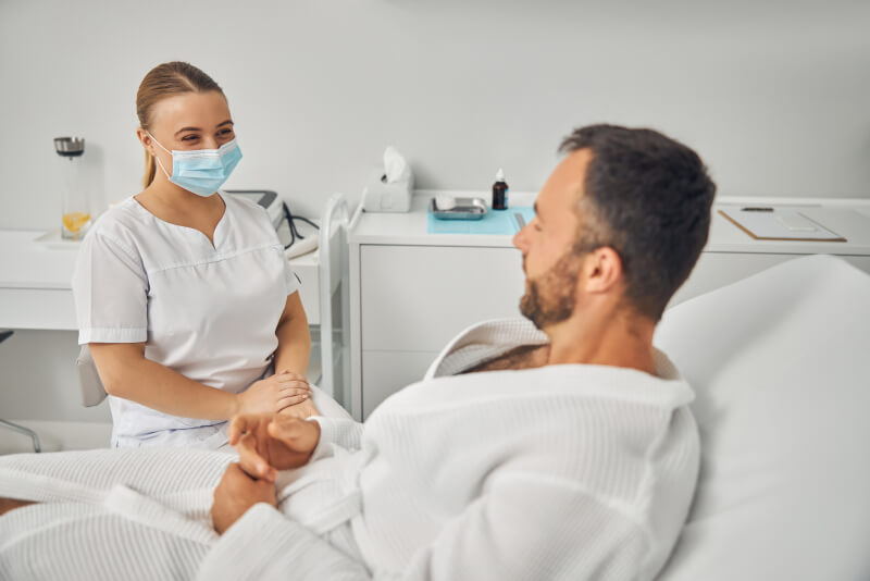 Charming beautician talking with young man