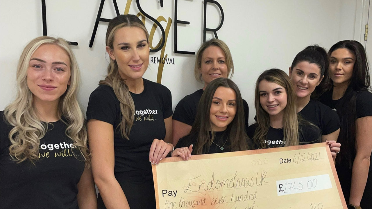 Helen Quayle, owner and founder of LaserHQ, pictured with her team and the cheque for £1,745 that will go to Endometriosis UK