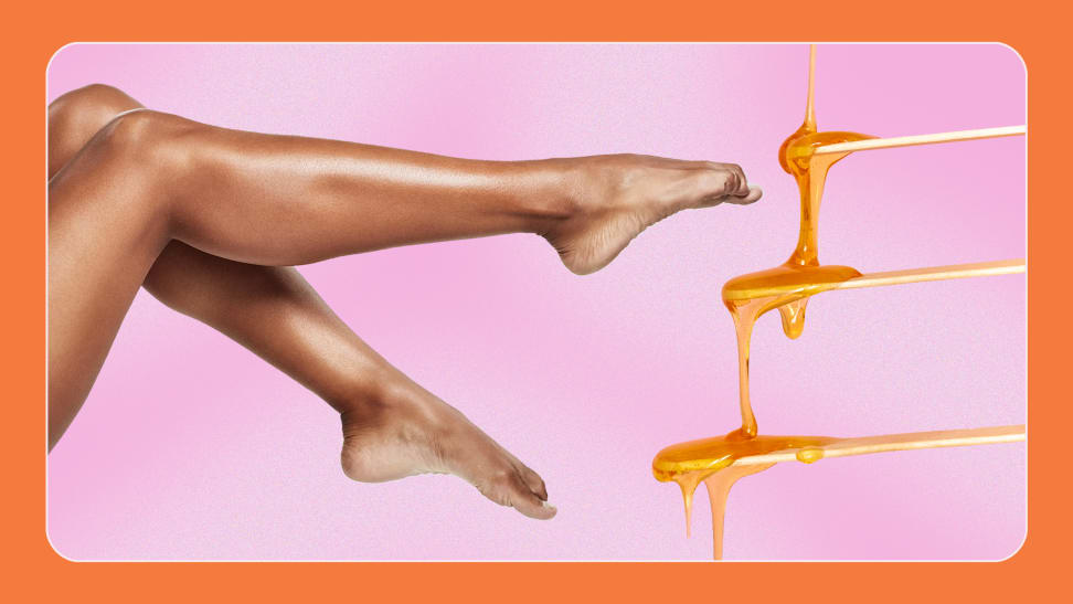 A pair of bare legs and wax dripping from wood swabs.