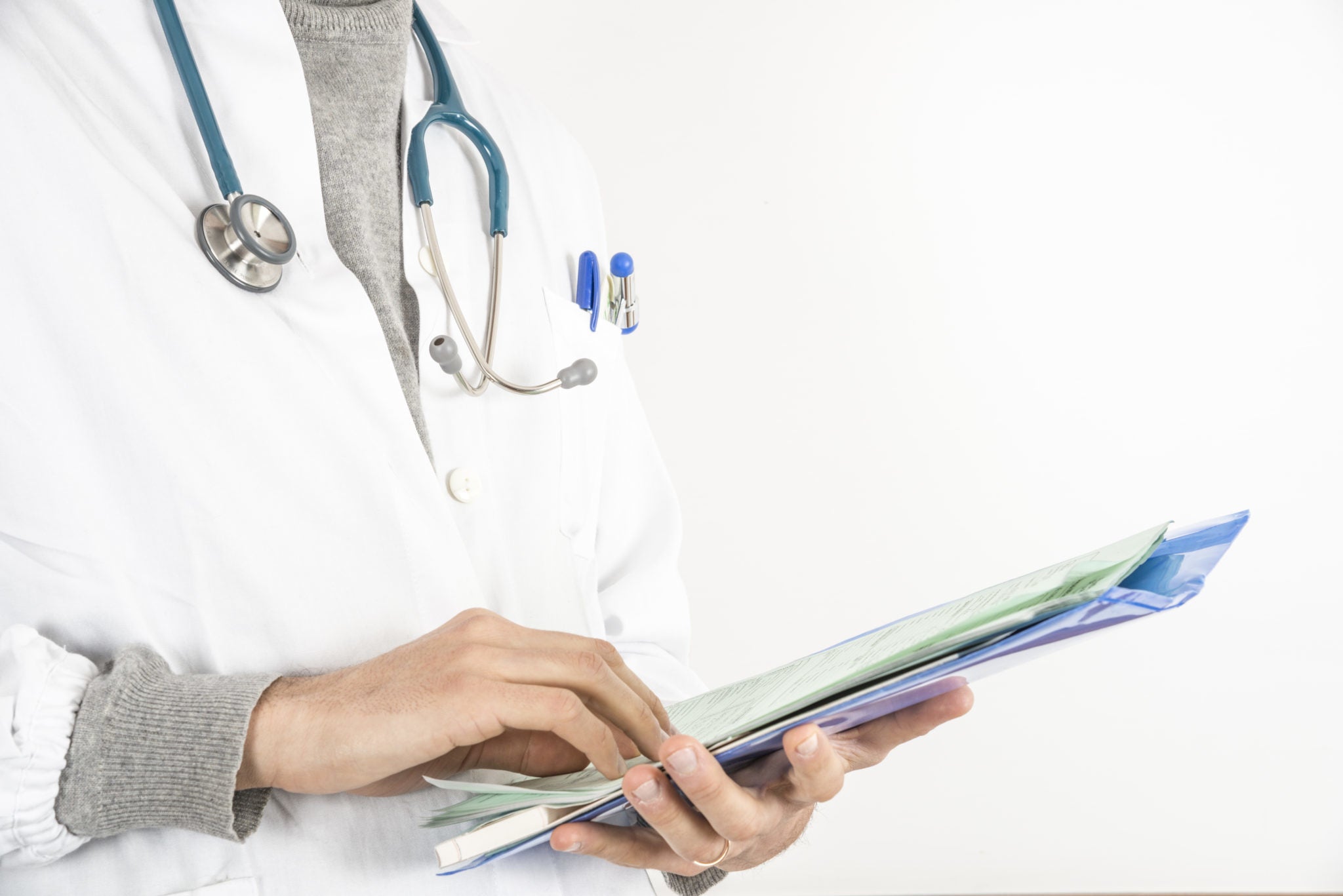 female doctor holding a clipboard 2048 x 1367