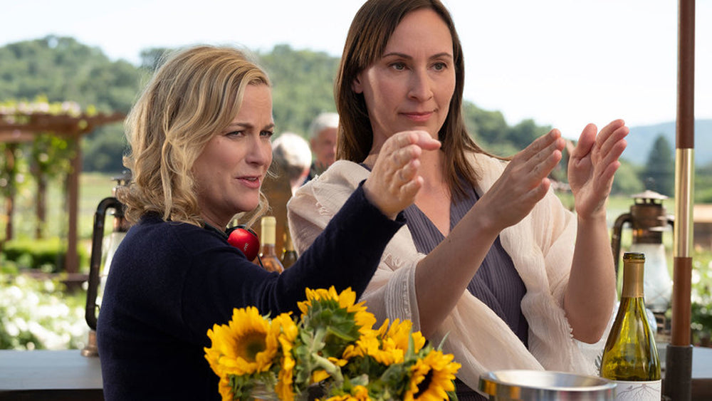 Amy Poehler and Liz Cackowski on the set of WINE COUNTRY. Courtesy of Netflix.