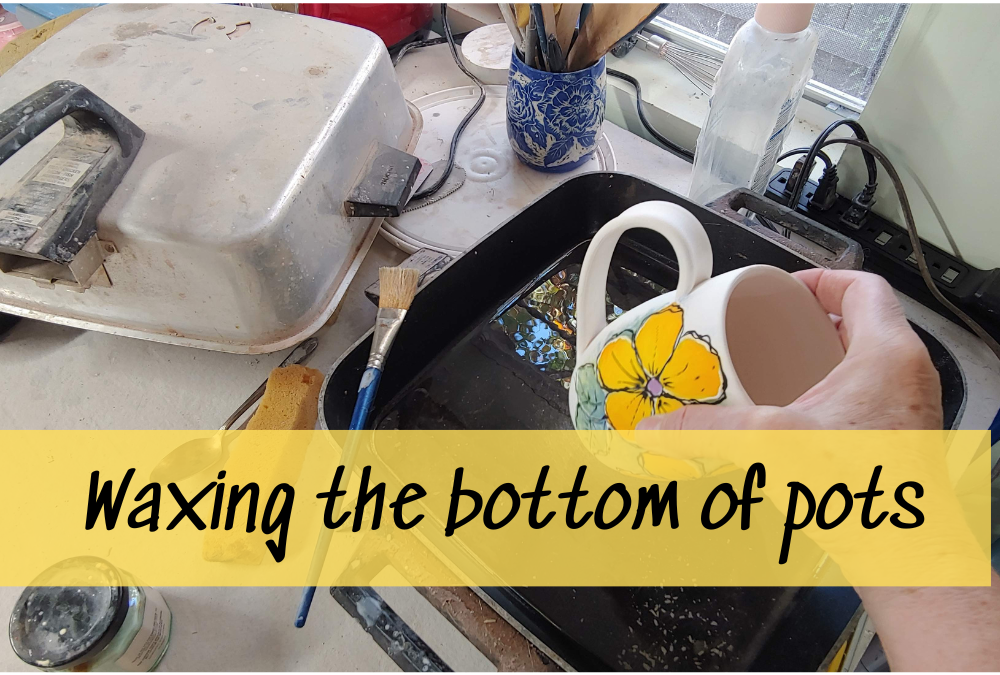 Waxing the bottom of pottery pots before glazing