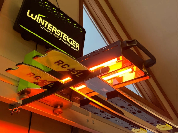 Wintersteiger Wax future being used to wax a pair of Fischer race skis