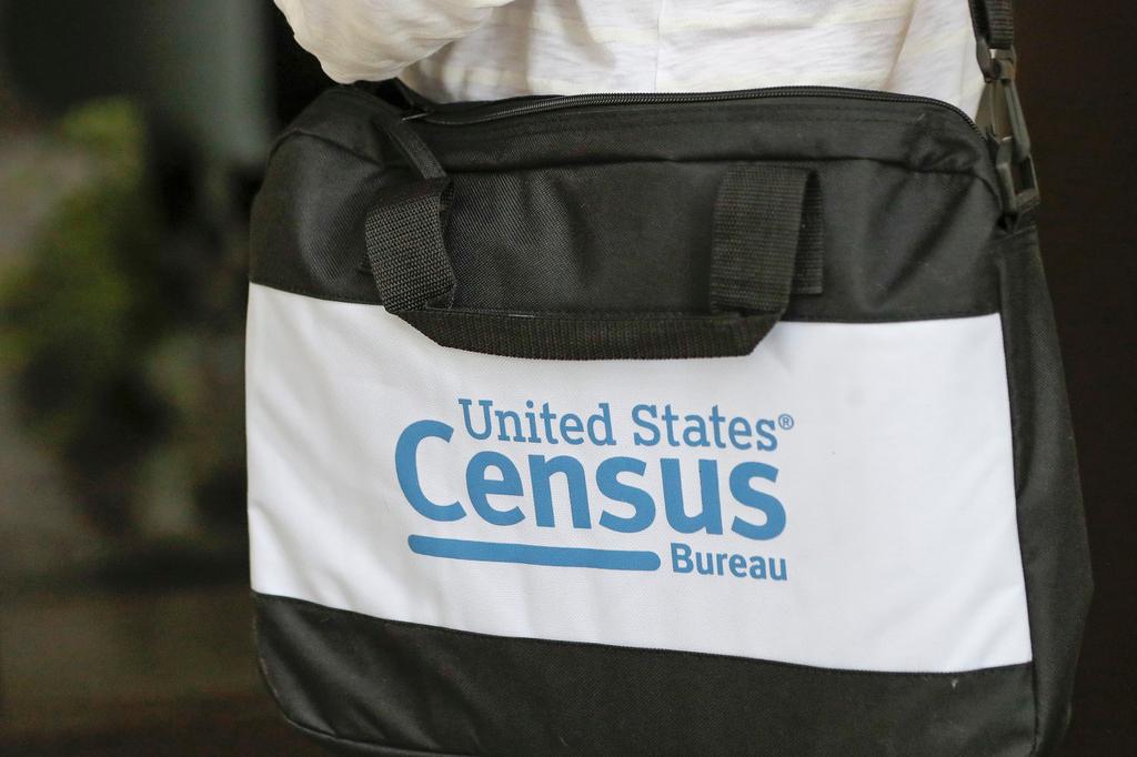 A census taker knocks on the door of a residence in 2020 at Winter Park, Florida. AP/John Raoux, file