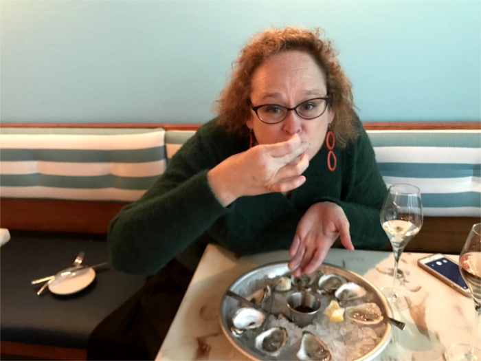 Author Joleen Jernigan pampers herself with bubbly and oysters at Aviary (Credit: Mike Thompson)