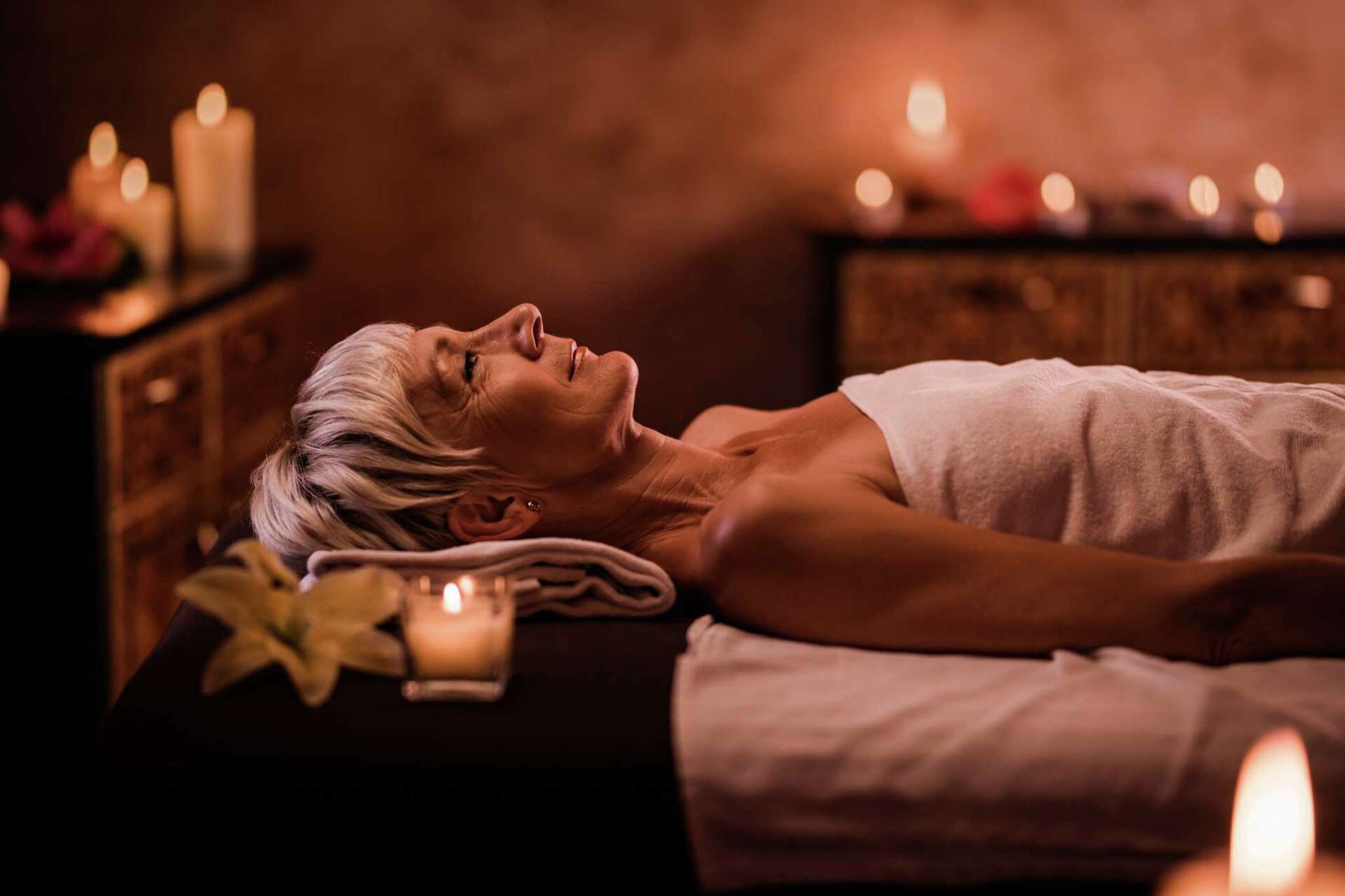 Mature woman having her relaxing moments at health spa.