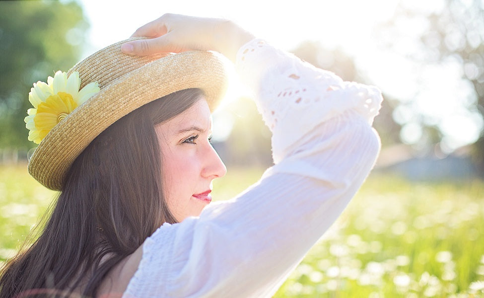 woman wearing hat in sun