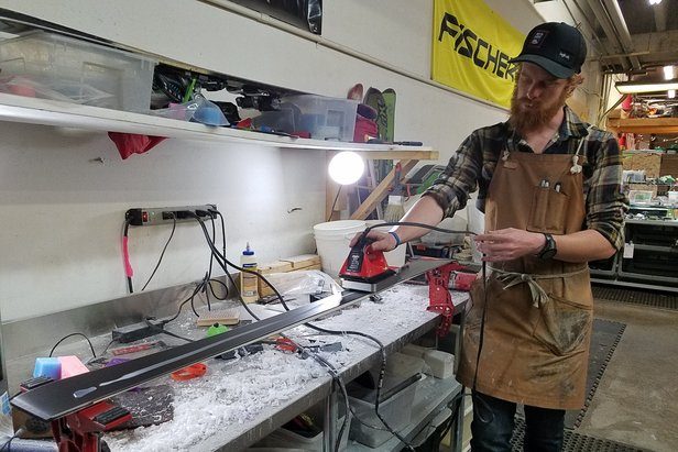 Leif Sunde irons a fresh coat of wax on the first pass. ©Heather B. Fried